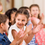 Preschool childs playing in classroom.