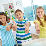 smiling-pupils-with-thumbs-up_1098-1206